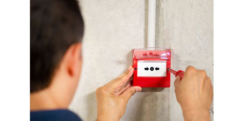 Man Installing Fire Security Break Glass